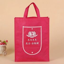 I sacchetti della spesa riutilizzabili rosso-chiaro che piegano in se stessi hanno personalizzato il logo