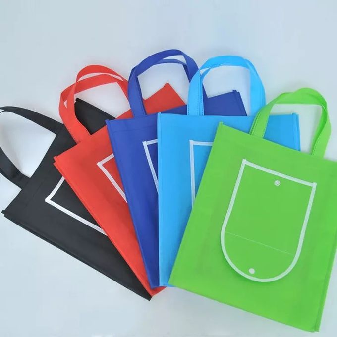 I sacchetti della spesa riutilizzabili rosso-chiaro che piegano in se stessi hanno personalizzato il logo